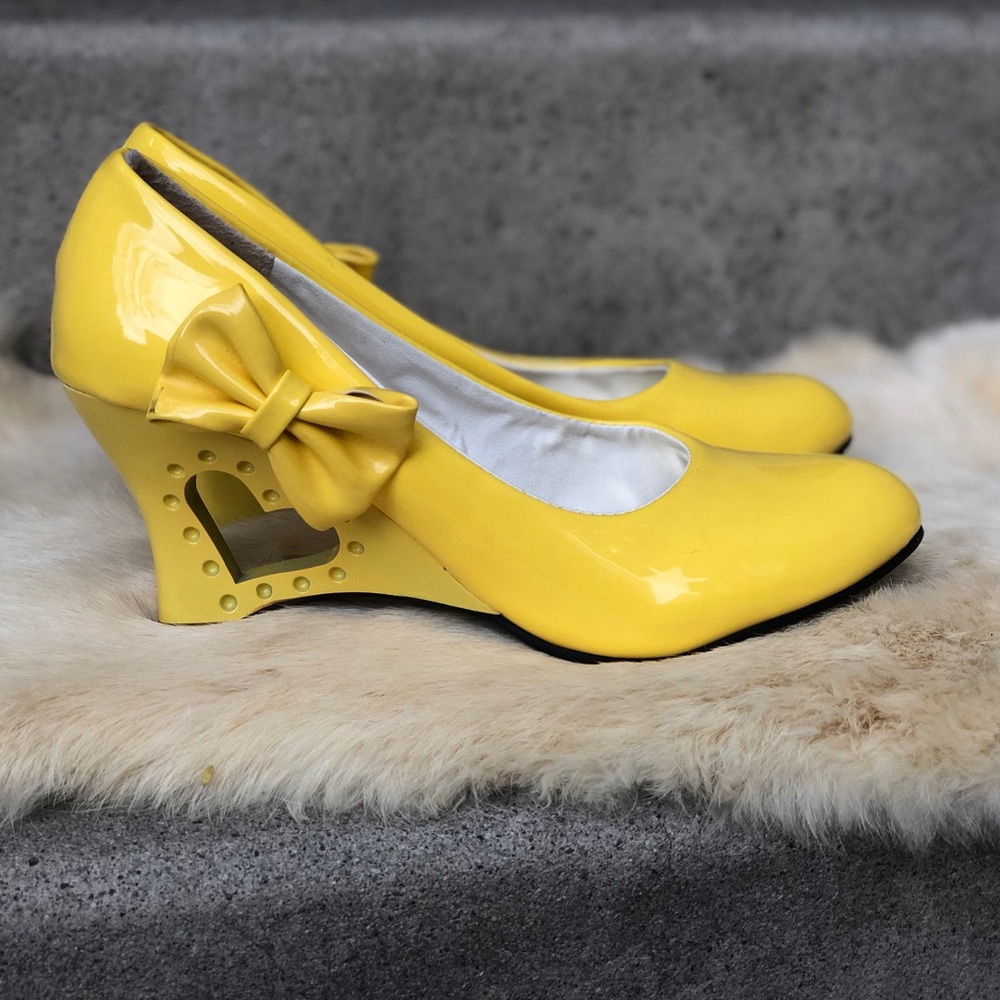 Bright yellow patent leather wedges